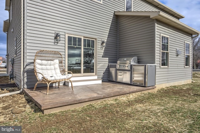 exterior space featuring exterior kitchen and a deck