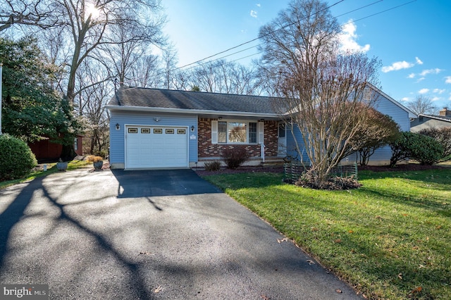 view of front facade with a front yard and a garage