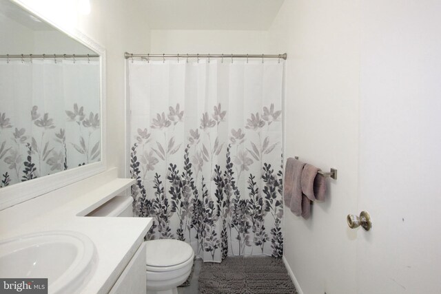 bathroom with vanity and toilet