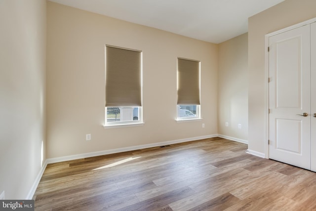 unfurnished room featuring light hardwood / wood-style flooring