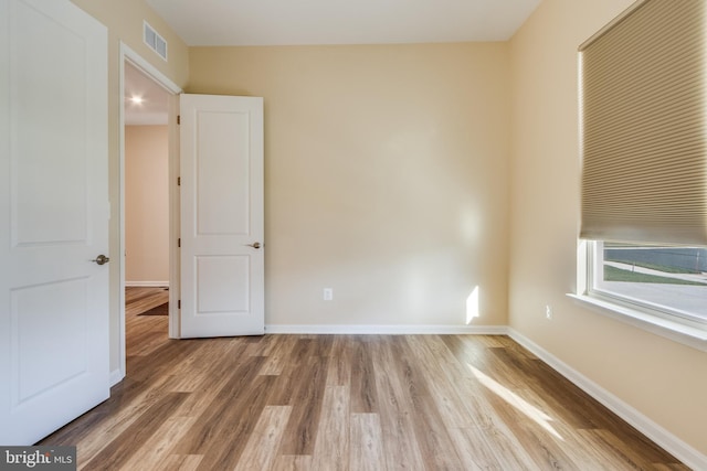 empty room featuring hardwood / wood-style floors