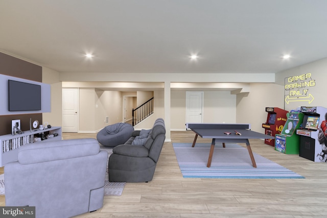 recreation room with light wood-type flooring