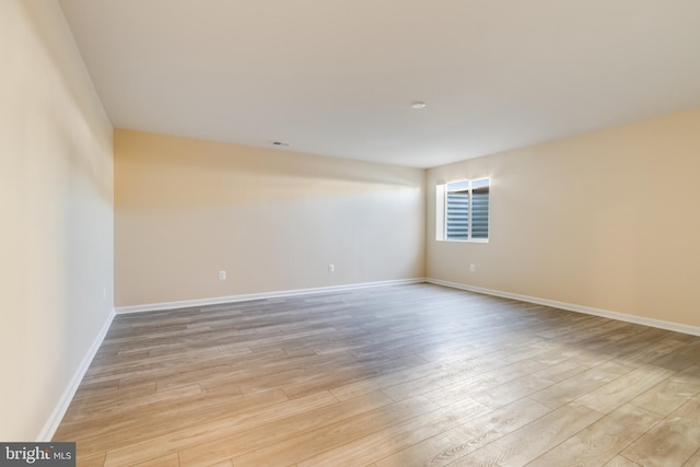 unfurnished room featuring light hardwood / wood-style flooring