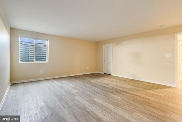 unfurnished room featuring light hardwood / wood-style floors