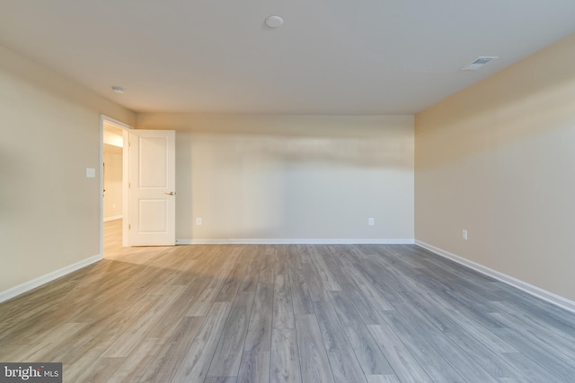 spare room featuring light hardwood / wood-style flooring