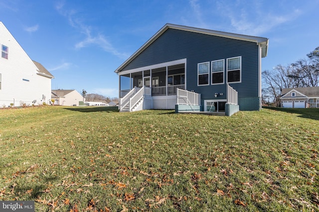 back of property with a sunroom and a lawn