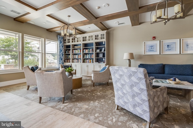 interior space with beam ceiling, an inviting chandelier, coffered ceiling, and hardwood / wood-style flooring