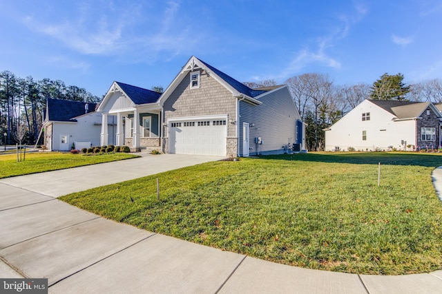 view of front of property with a front yard and a garage