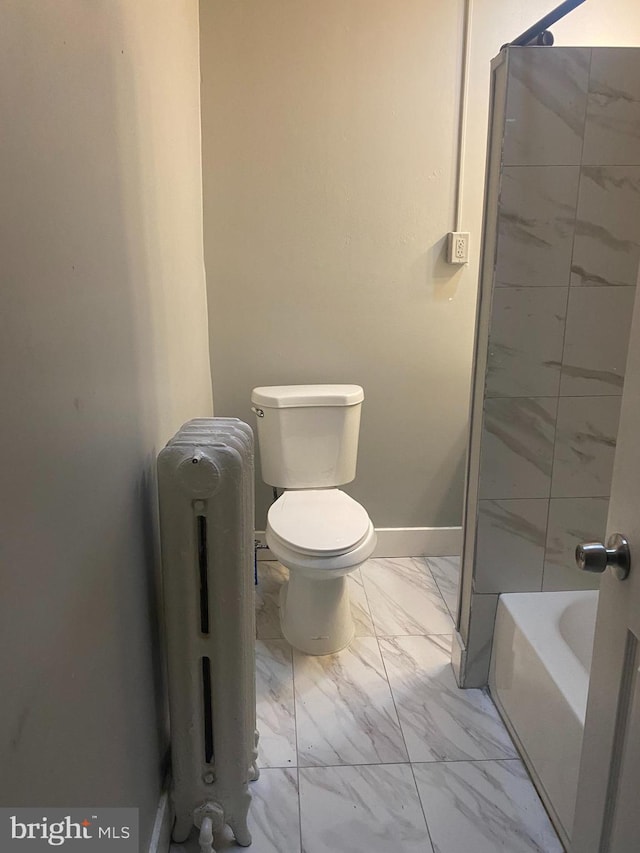 bathroom featuring radiator, plus walk in shower, and toilet