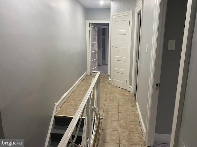 hallway featuring light tile patterned floors