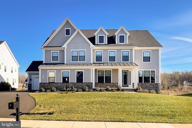 view of front facade with a garage and a front lawn