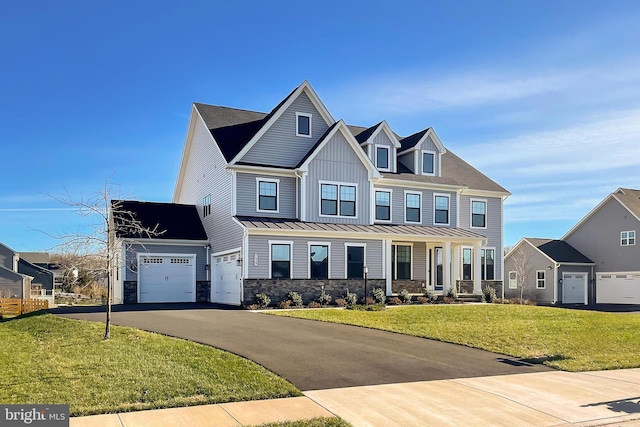 view of front of property with a garage and a front lawn