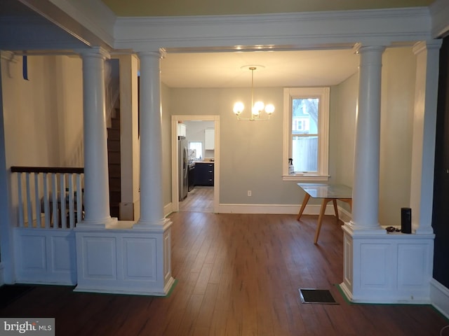 hall with a notable chandelier and dark hardwood / wood-style floors