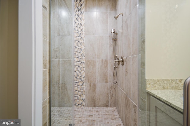 bathroom featuring a shower with door