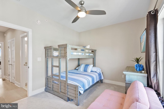 bedroom featuring ceiling fan and light colored carpet