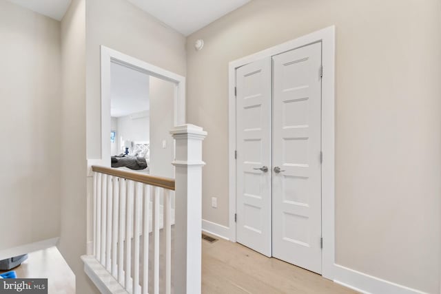 hallway featuring light hardwood / wood-style flooring