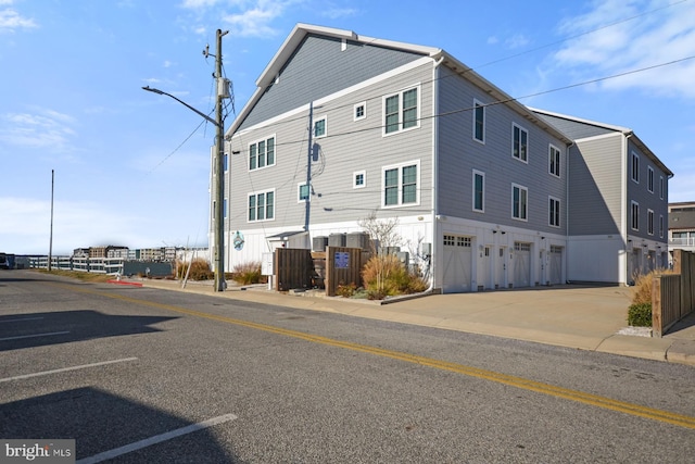 rear view of property featuring a garage