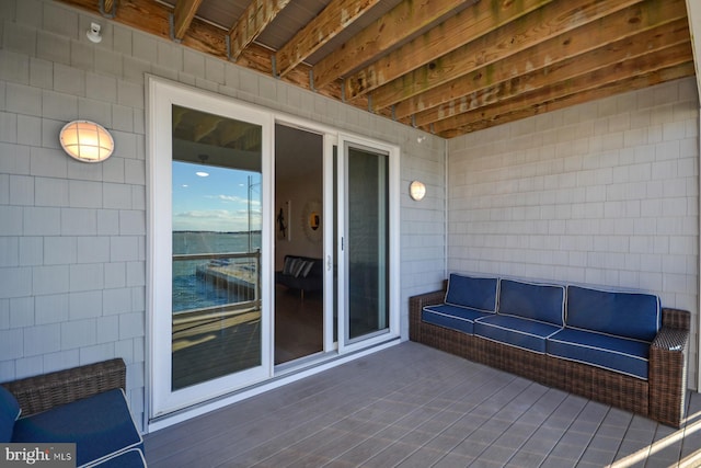 view of patio / terrace featuring a deck with water view and an outdoor hangout area