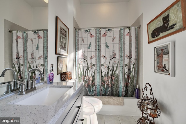 full bathroom featuring toilet, vanity, tile patterned floors, and shower / tub combo with curtain