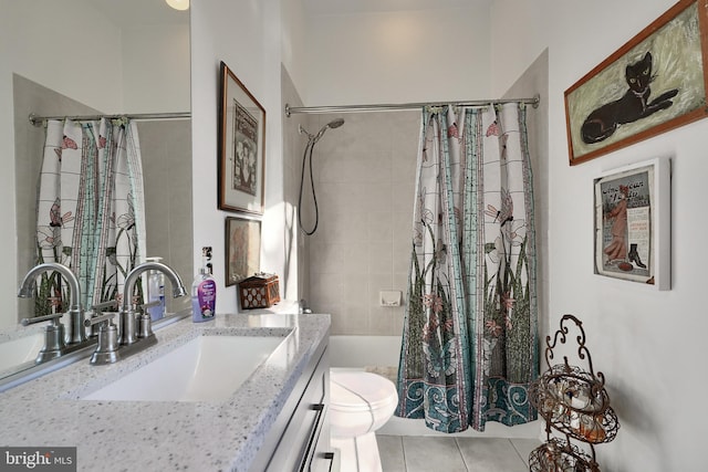 bathroom featuring tile patterned floors, vanity, and toilet