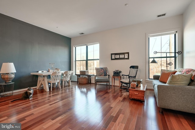 living room with dark hardwood / wood-style floors