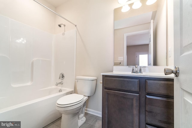 full bathroom featuring toilet, vanity, bathtub / shower combination, and tile patterned floors