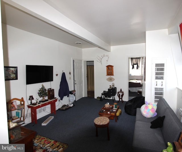 living room with beamed ceiling