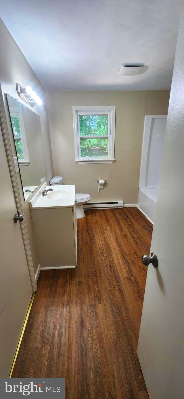 6130 Pine Knoll Dr, Harrisburg, PA 17111 - bathroom featuring a baseboard heating unit, vanity, toilet, and wood finished floors