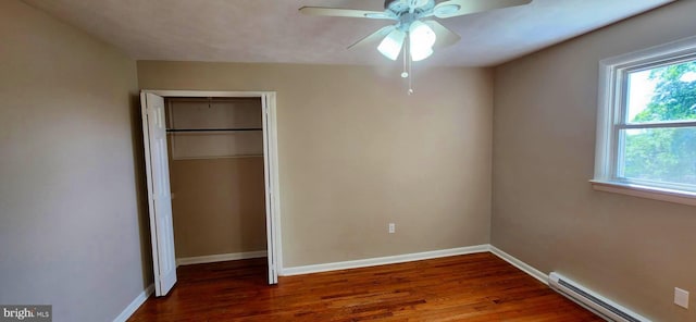6130 Pine Knoll Dr, Harrisburg, PA 17111 - unfurnished bedroom with baseboard heating, wood finished floors, and multiple windows