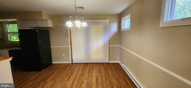 6130 Pine Knoll Dr, Harrisburg, PA 17111 - unfurnished dining area featuring wood finished floors, healthy amount of natural light, and a chandelier