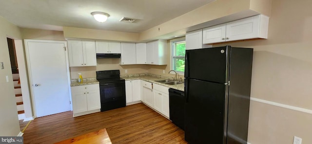 6130 Pine Knoll Dr, Harrisburg, PA 17111 - kitchen featuring black appliances, a sink, under cabinet range hood, and white cabinetry