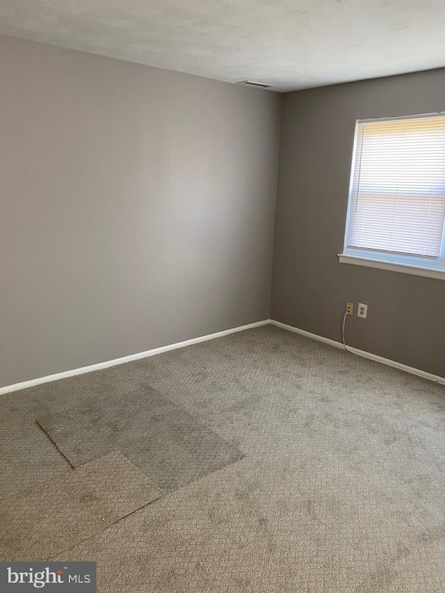 unfurnished room with carpet