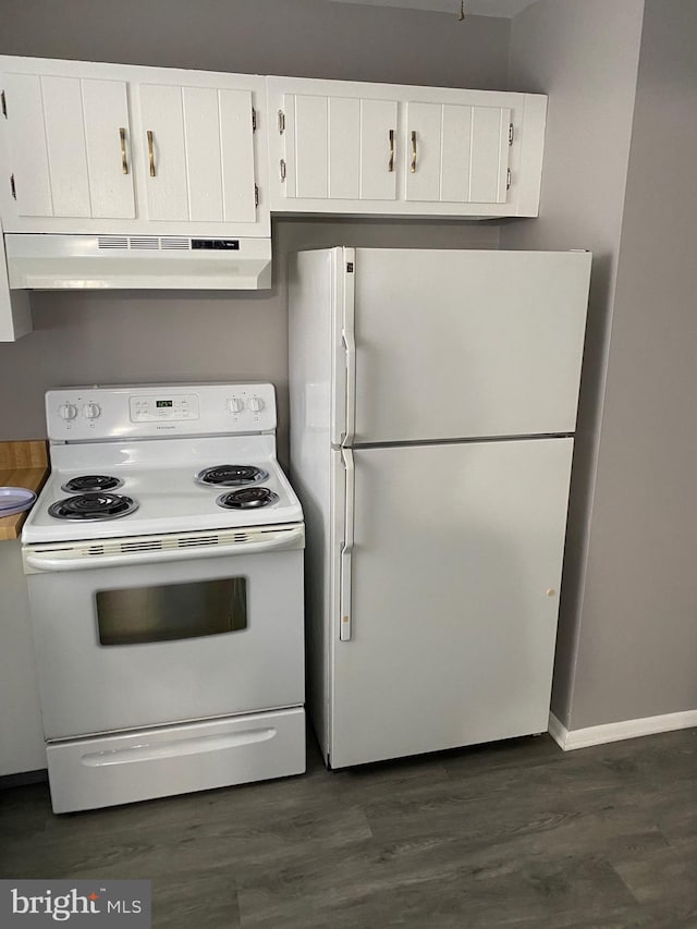 kitchen featuring white cabinets, dark hardwood / wood-style floors, and white appliances