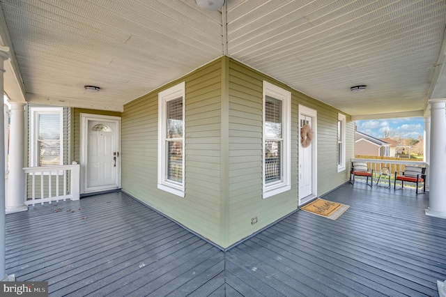 wooden terrace with a porch