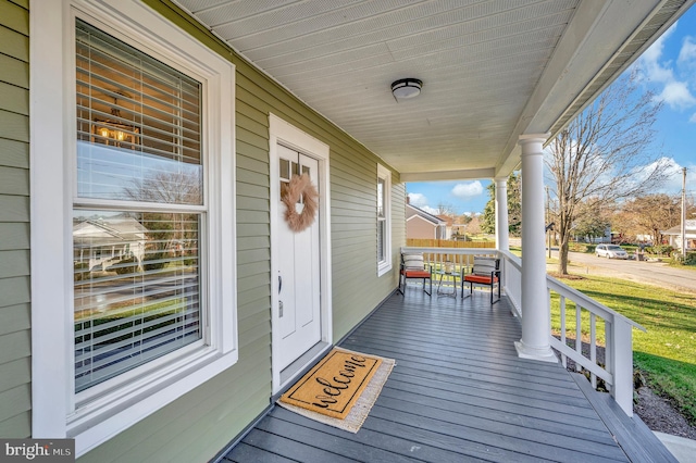 wooden terrace with a porch