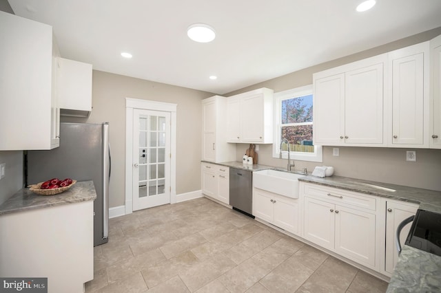 kitchen with white cabinetry, sink, and appliances with stainless steel finishes