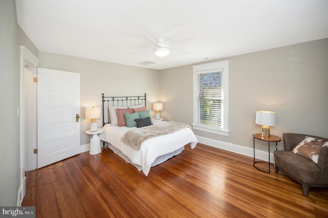 bedroom with ceiling fan and wood-type flooring