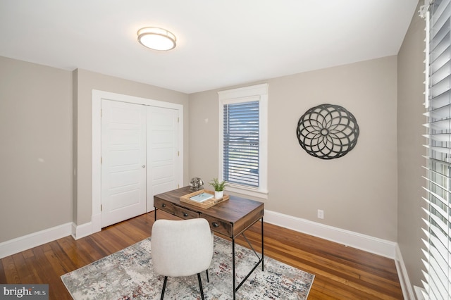 office with dark hardwood / wood-style floors