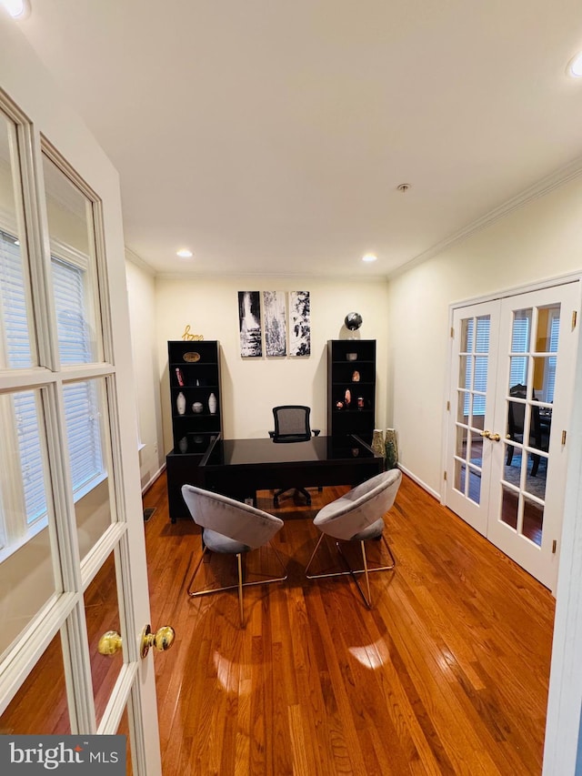 recreation room featuring crown molding, french doors, and wood-type flooring