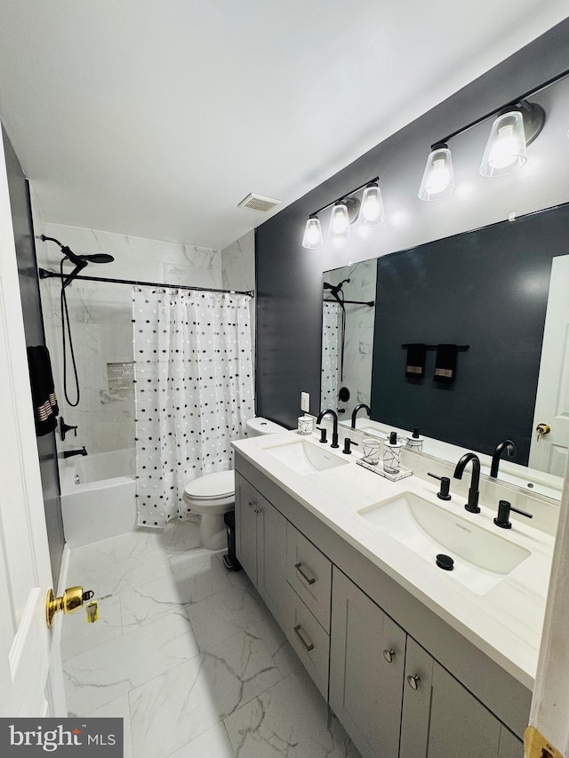 full bathroom with shower / bath combination with curtain, vanity, and toilet