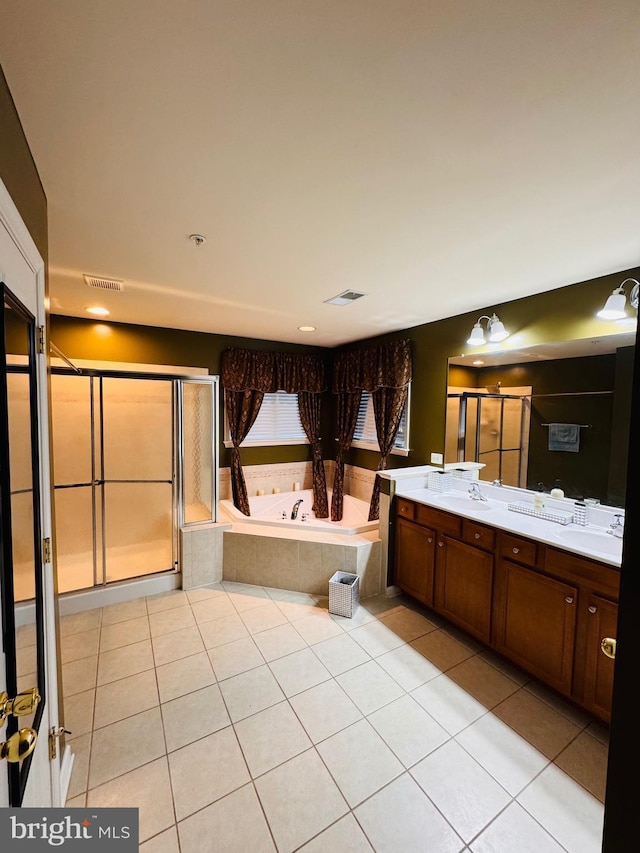 bathroom featuring tile patterned floors, vanity, and plus walk in shower