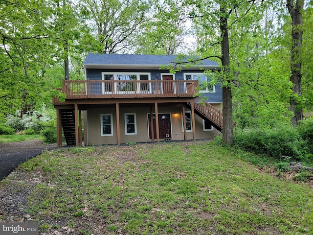 front of property featuring a deck