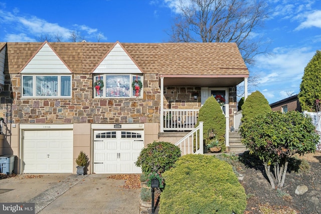 view of front of home with covered porch and a garage