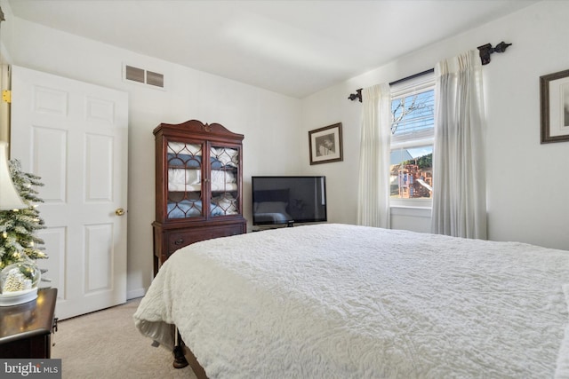 bedroom with light carpet