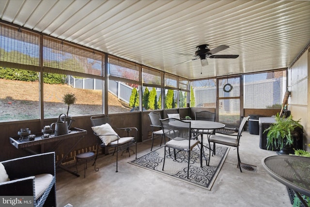 sunroom featuring ceiling fan