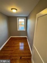 empty room featuring dark wood-type flooring