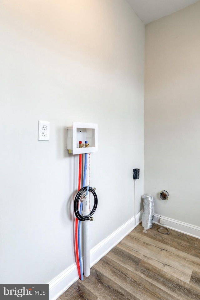 laundry area with washer hookup, hookup for an electric dryer, and wood-type flooring