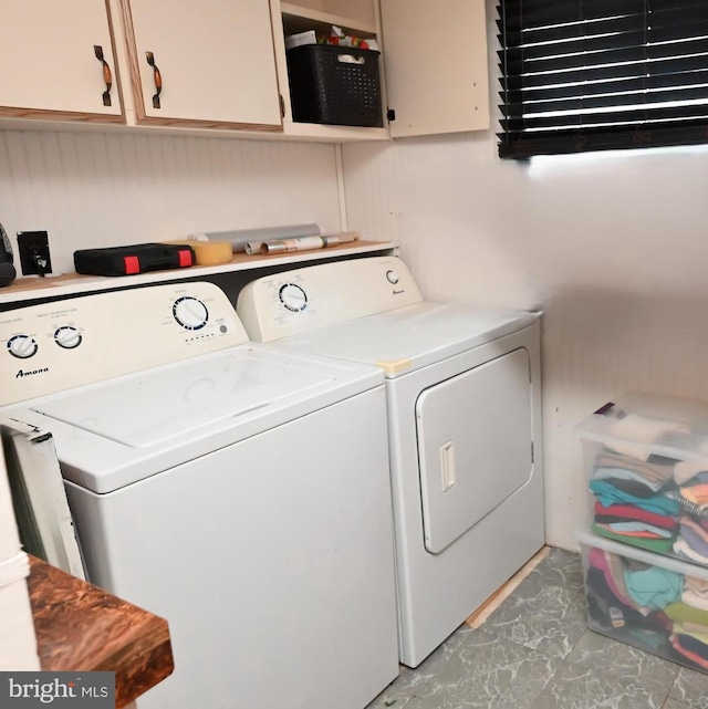 laundry area with cabinets and independent washer and dryer