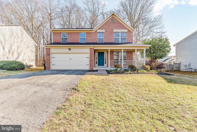 view of front of property with a porch, a garage, and a front lawn