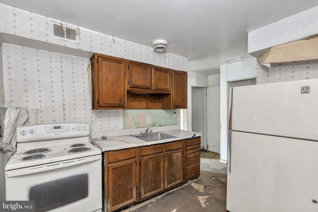 kitchen with sink and white appliances